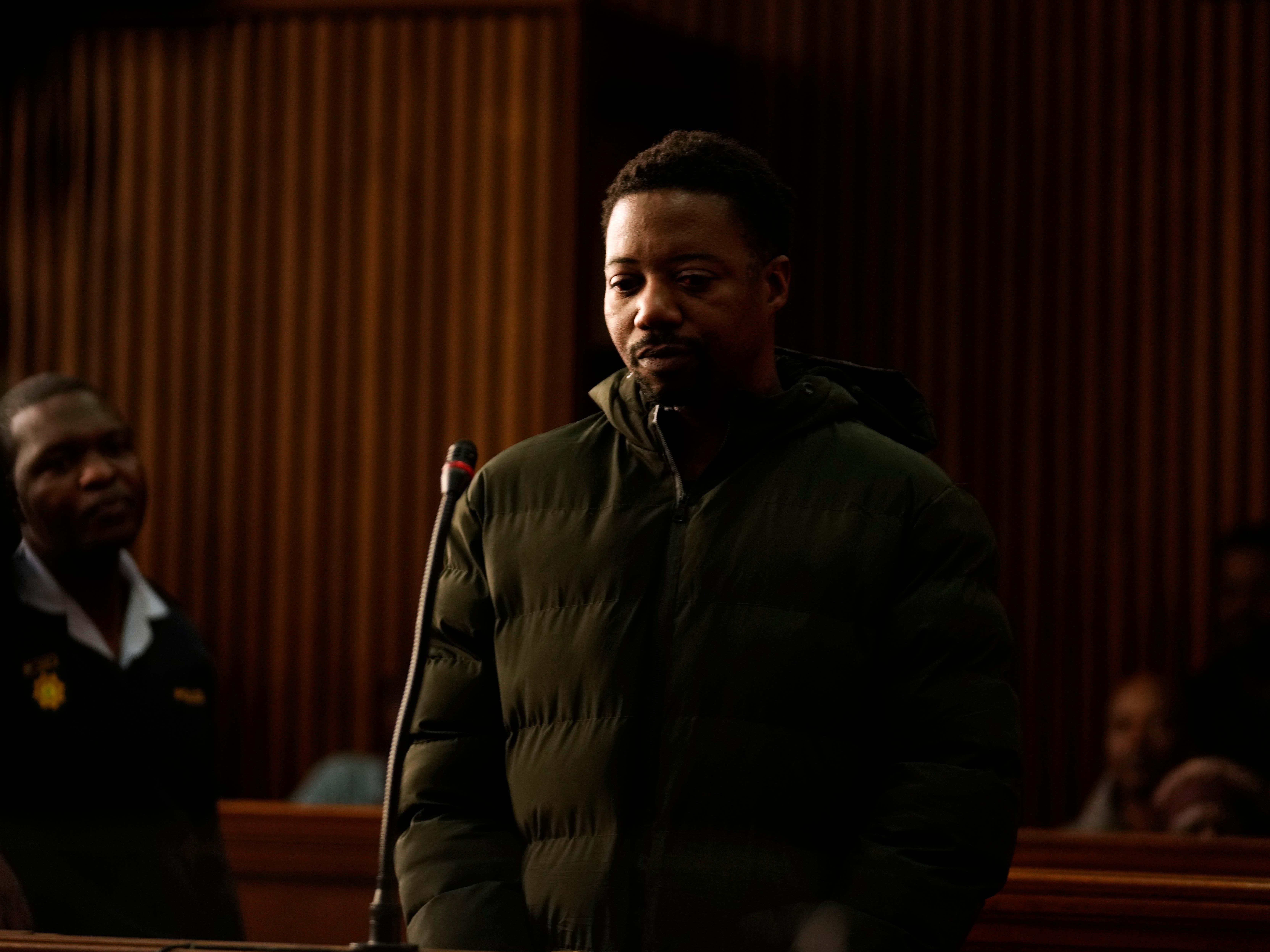 Man wanted over UK deaths of wife and daughters appears in court in South Africa